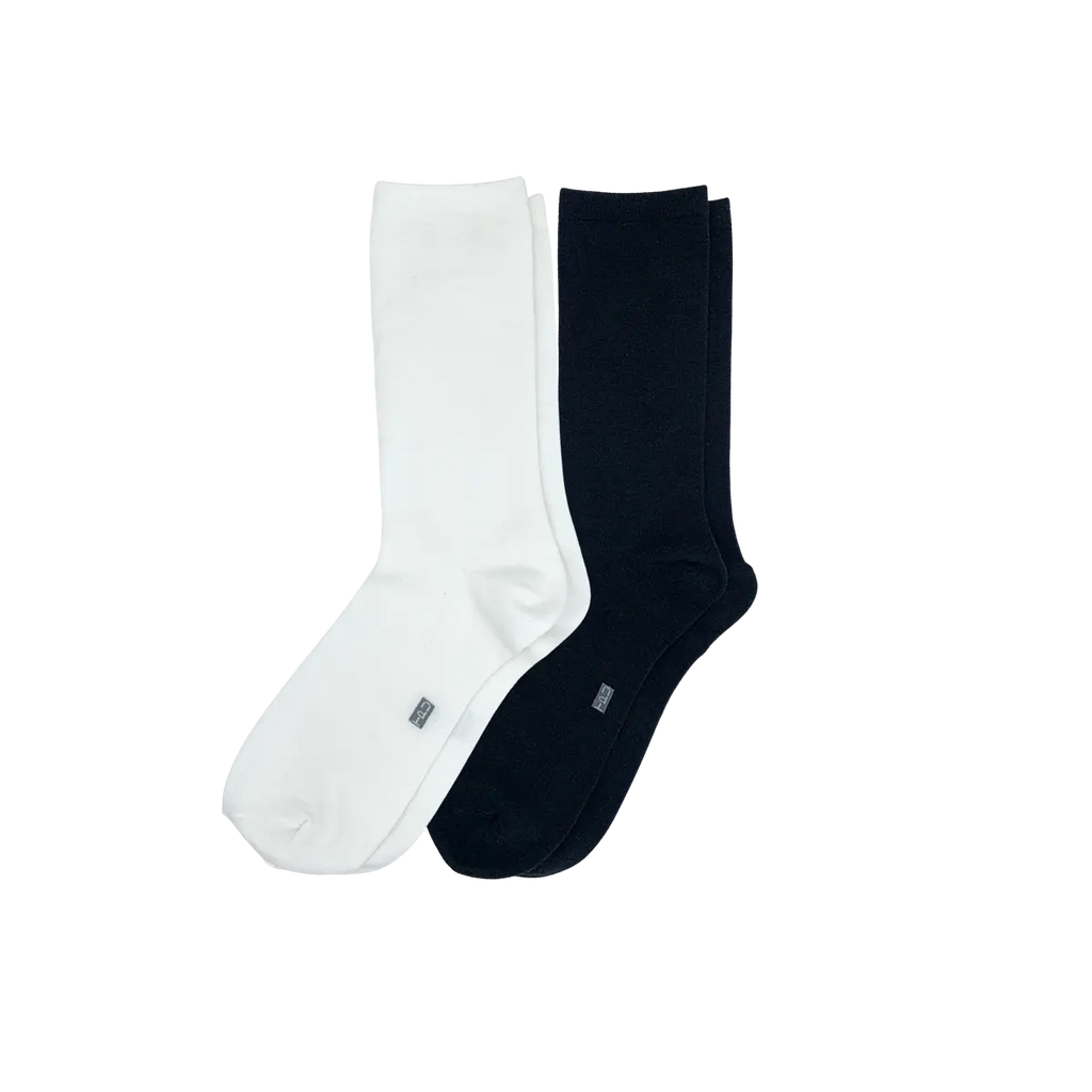 The Perfect Underwear bamboo crew socks in black and white, showing one black sock and one white sock arranged side by side.