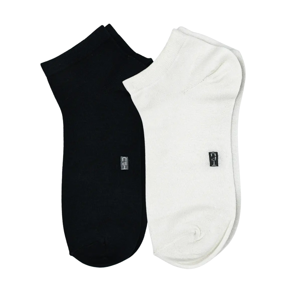 The Perfect Underwear bamboo low cut socks in black and white, showing one black sock and one white sock placed side by side.