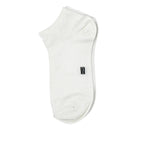 The Perfect Underwear bamboo socks in white, showing a single sock from the side with a small woven brand logo.